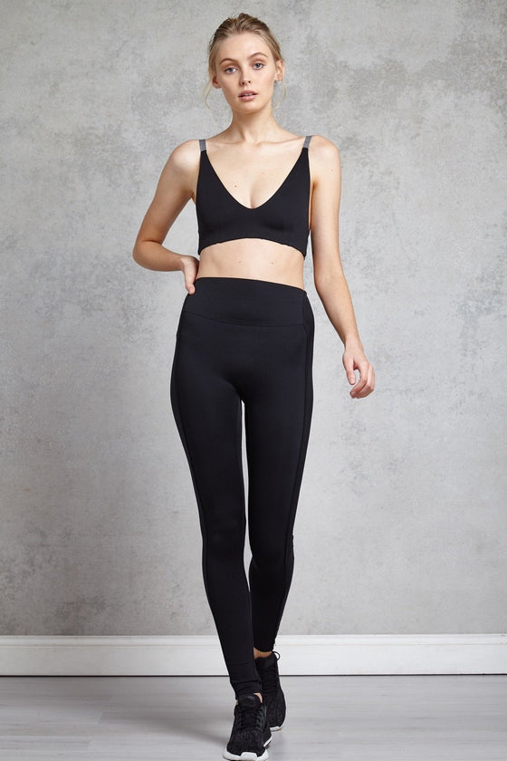 Full body length front view of a woman wearing Cindy Bralette - Black and black leggings