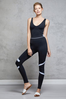  Full body length front view of a woman wearing Caroline Legging - Black / Cornflower and a black top