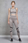 Full body length front view of a woman wearing Chloe Crop Bra - Nude and matching leggings