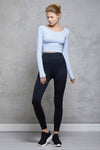 Full body length front view of a woman wearing Bojana Ballet Top - Cornflower Blue and blue sweatpants