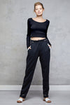 Full body length front view of a woman wearing Bojana Ballet Top - Black and black sweatpants
