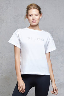  Front view of a woman wearing Silou Tee - White