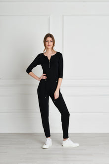  Full body length front view of a woman wearing Natalia Jumpsuit - Black