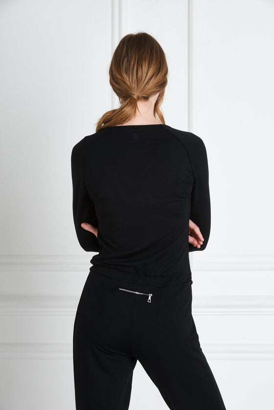 Back view of a woman wearing Natalia Jumpsuit - Black