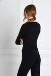 Back view of a woman wearing Natalia Jumpsuit - Black